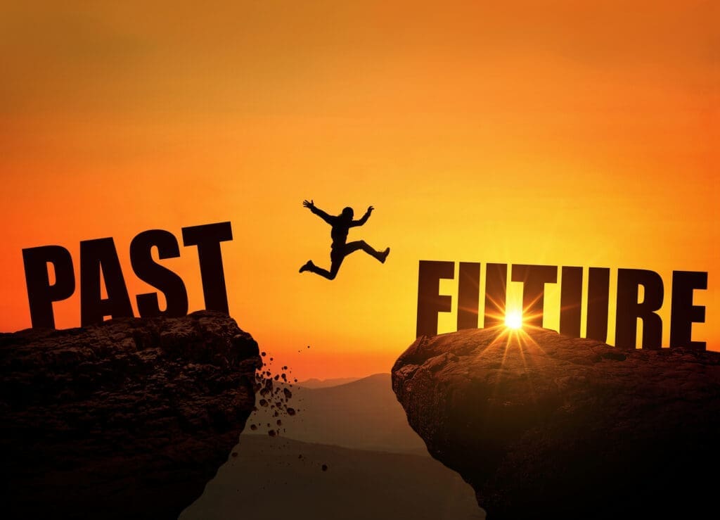 Jumping a gap from Past to Future. Credit: https://www.istockphoto.com/portfolio/AlonesCreative?mediatype=photography