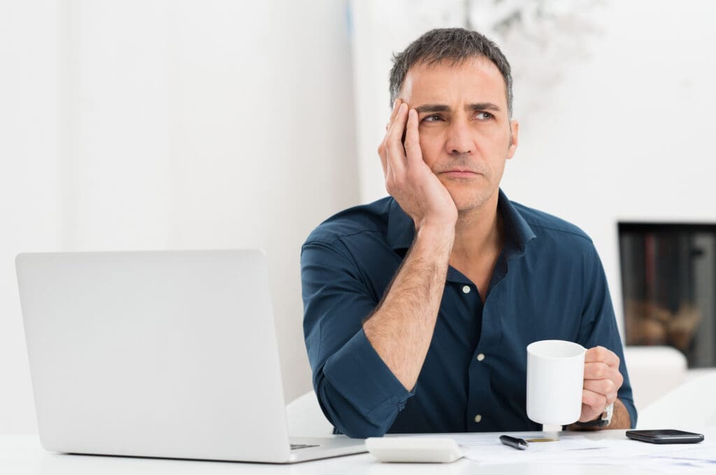 A businessman pondering why he measures performance. Credit: https://www.istockphoto.com/portfolio/Ridofranz?mediatype=photography