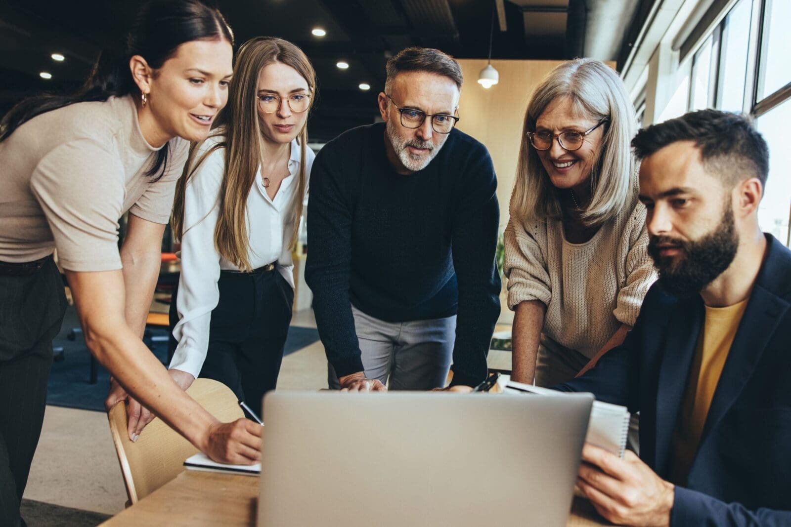 Evidence-Based Leadership team using a laptop while working together in an office. CREDIT: https://www.istockphoto.com/portfolio/jacoblund