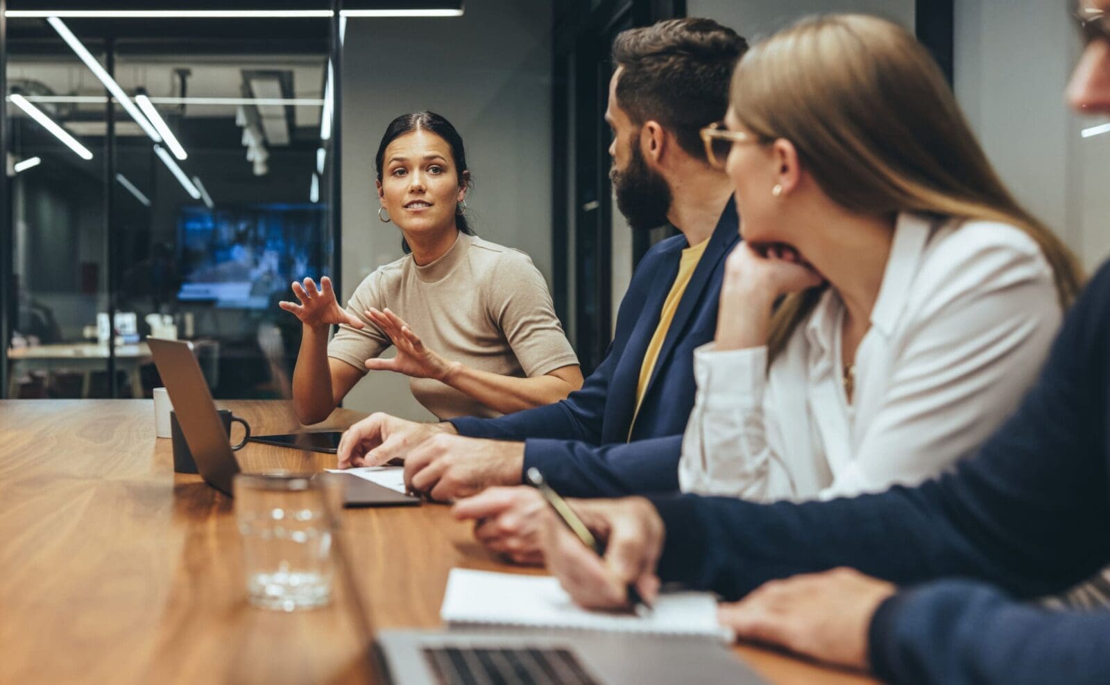 Young businesswoman leading her colleagues in a strategy discussion in a boardroom. CREDIT: https://www.istockphoto.com/portfolio/jacoblund