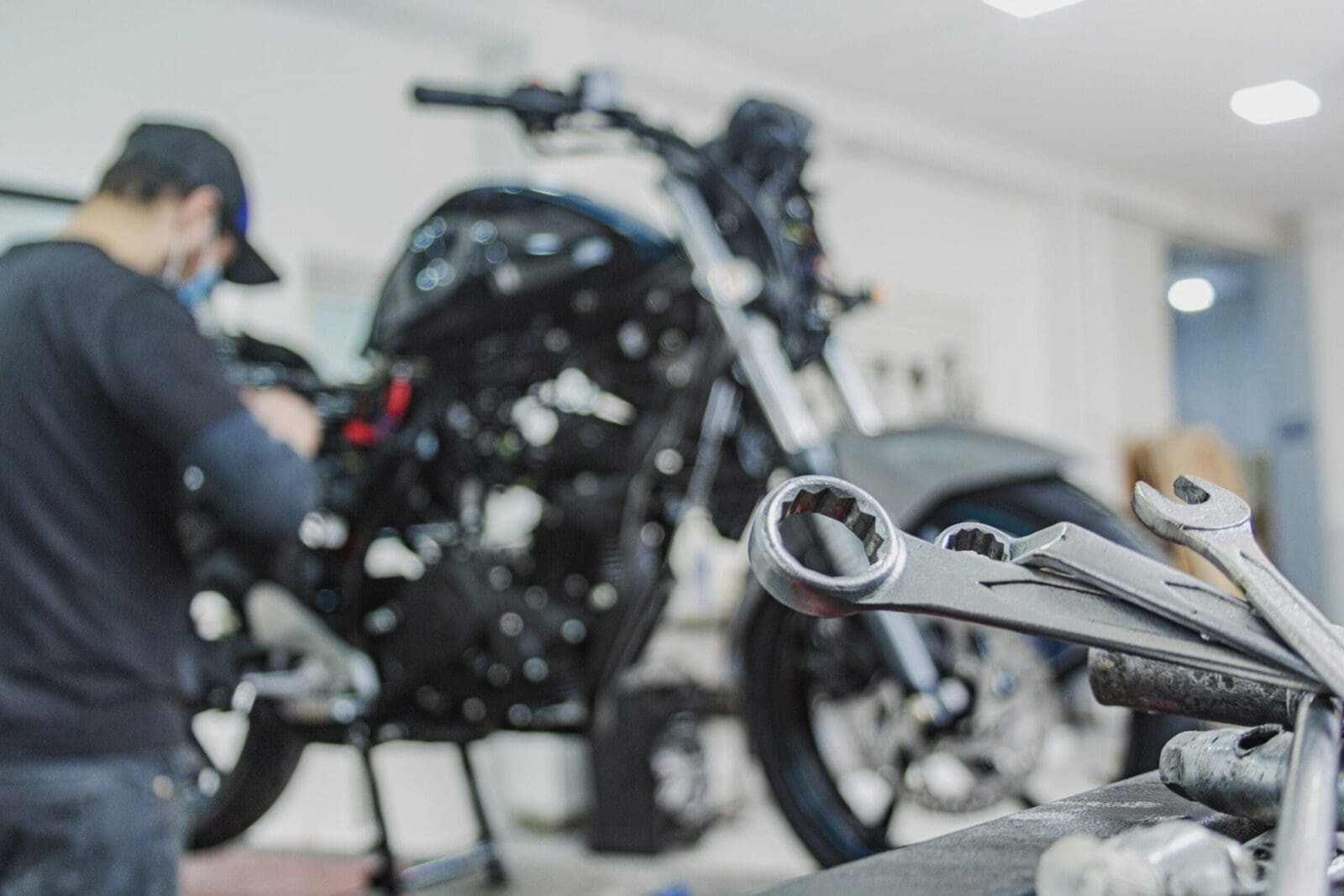 A mechanic usings tools to work on a motorbike . CREDIT: https://www.istockphoto.com/portfolio/rjankovsky