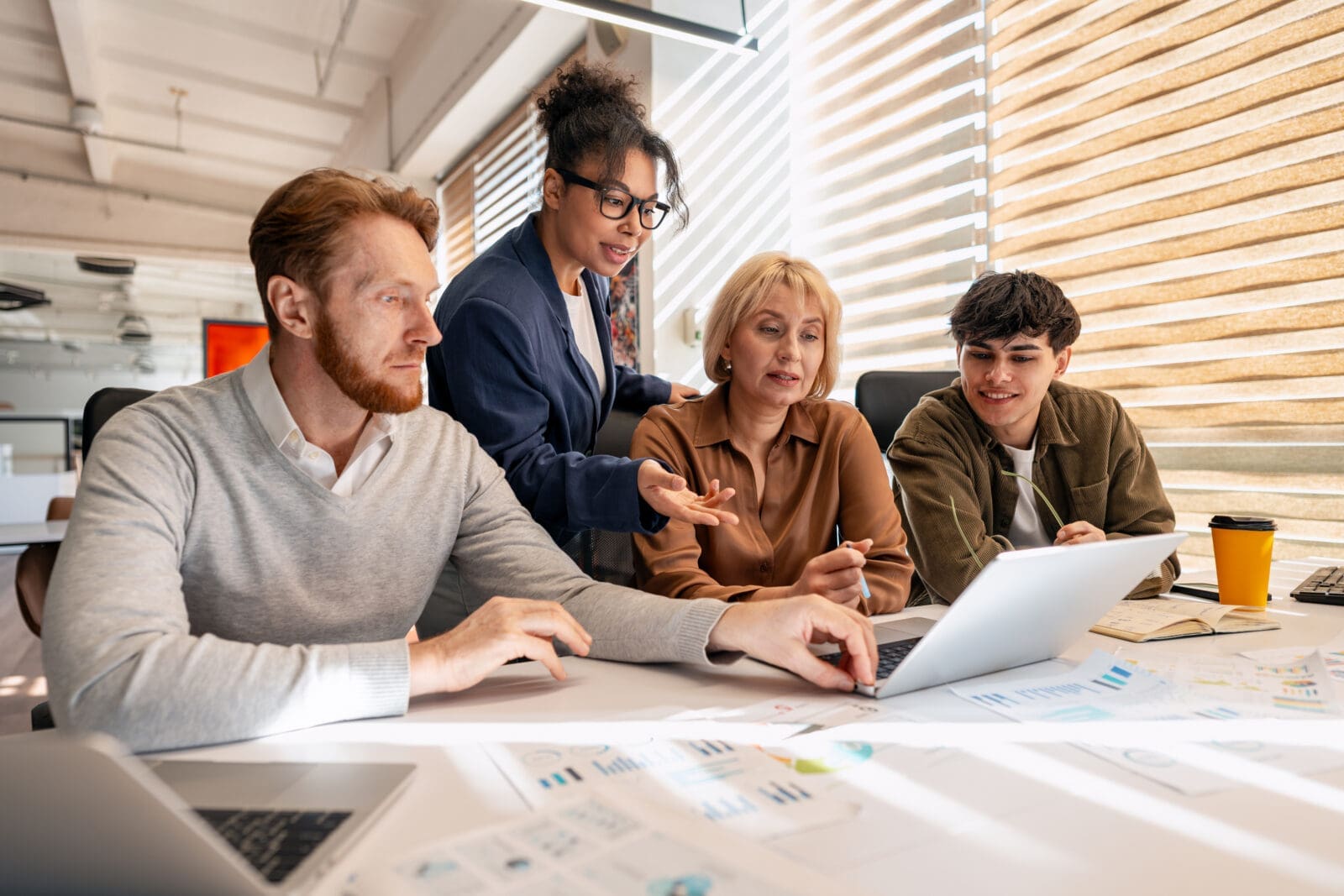 The 4 owners of a KPI collaborating on how to define it, get the data, report it, and use it to improve performance.