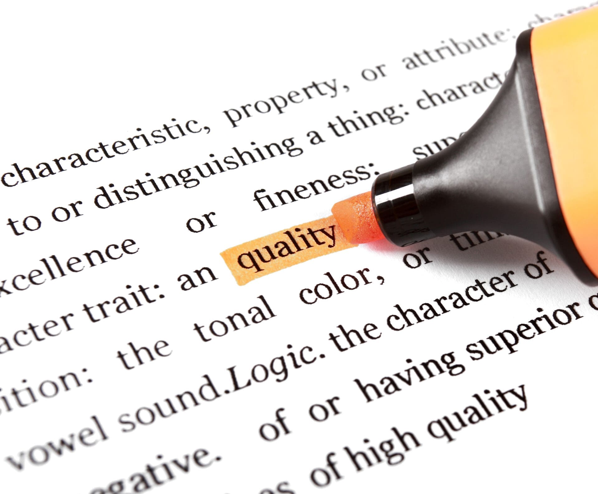 CREDIT: https://www.istockphoto.com/portfolio/ferlistockphoto?mediatype=photography A highlighter marks the word 'quality' in a dictionary definition — a reminder that even the weasel word 'quality' can mean a goal isn't clear enough to measure.